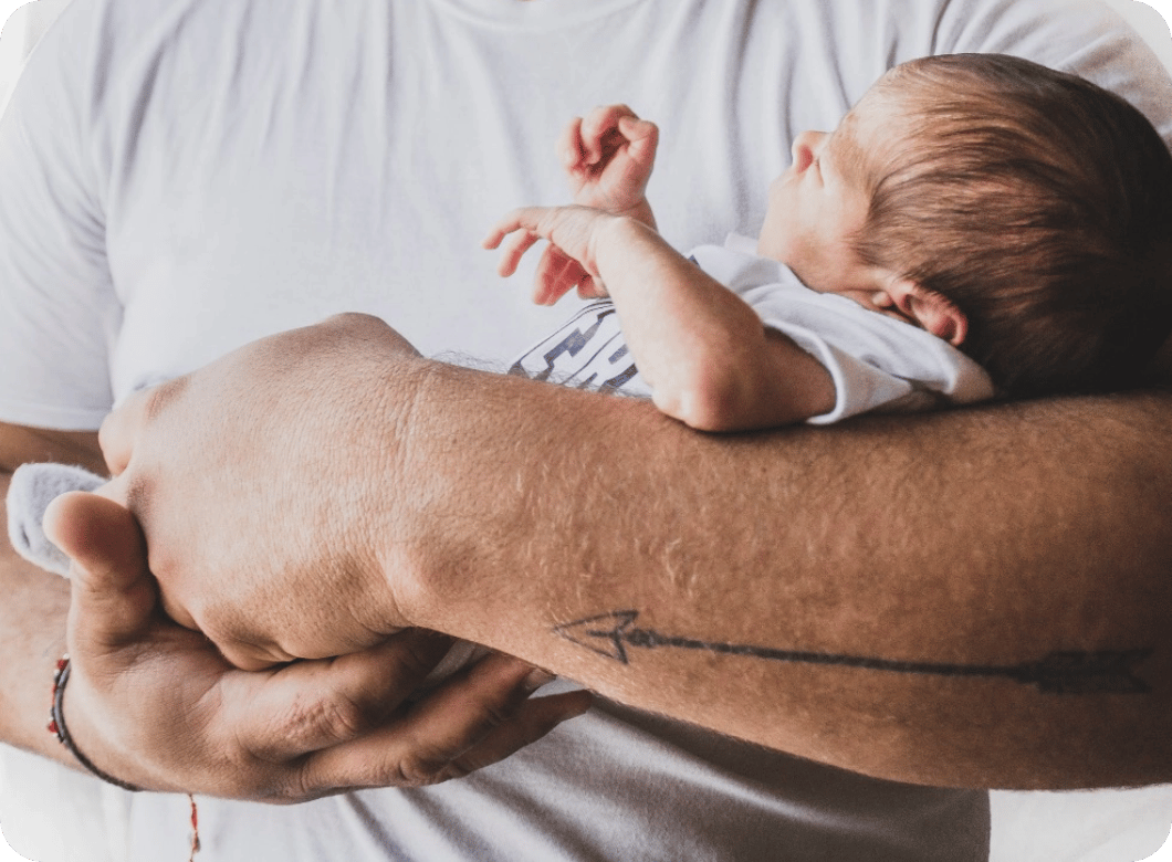person-holding-newborn@2x